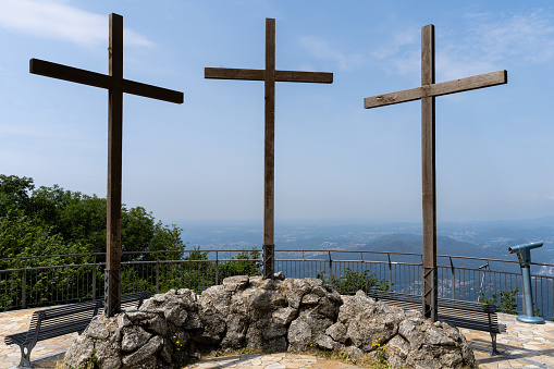 A golden Christian Cross on top of a dome