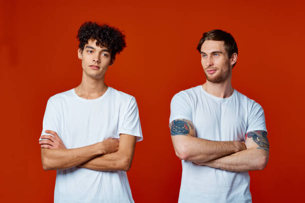 istock two friends in white t-shirts construction teams he emotions red background 2056189389