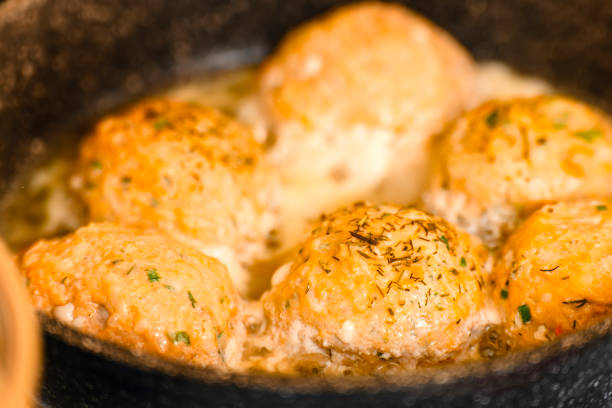 istock Red fish meatballs are fried in a frying pan 2056212690
