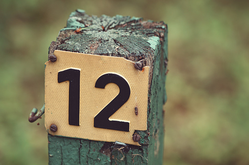 Photo of a pole with the number twelve on it