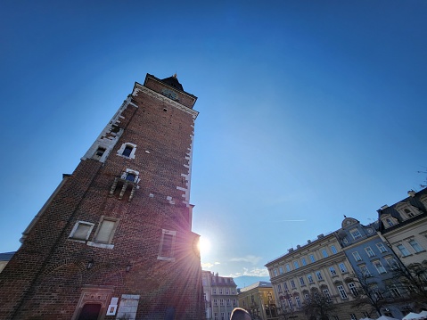 Old town of Gdansk, Srodmiescie historic district - tourists strolling along the Dluga street and chilling in cafes. Gdansk historic museum is on the background.