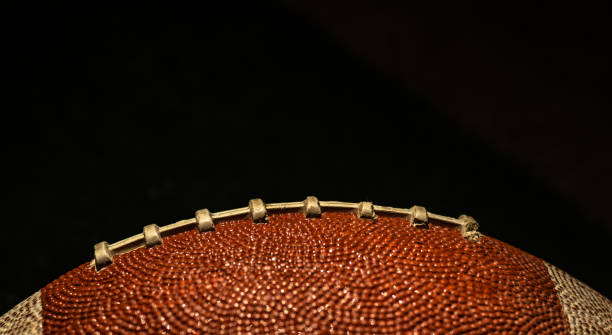 istock American football ball texture as background 2056250821