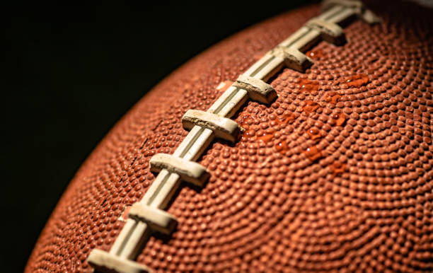istock American football ball texture as background 2056251324