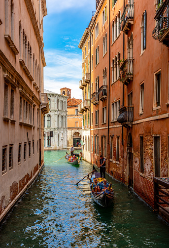 Venice, Italy - October 2022: Gondolas on Venice canals