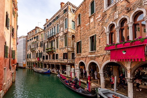 Venice, Italy - October 2022: Gondolas on Venice canals