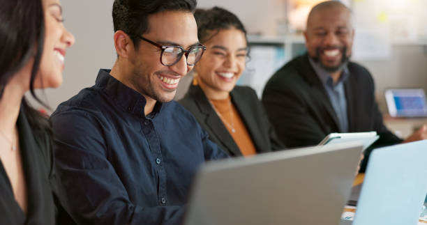 istock Man, presenter and collaboration with team in office for startup, strategy or business planning in New York. People, diversity and laugh at joke for work, technology or online documents for meeting 2056273239