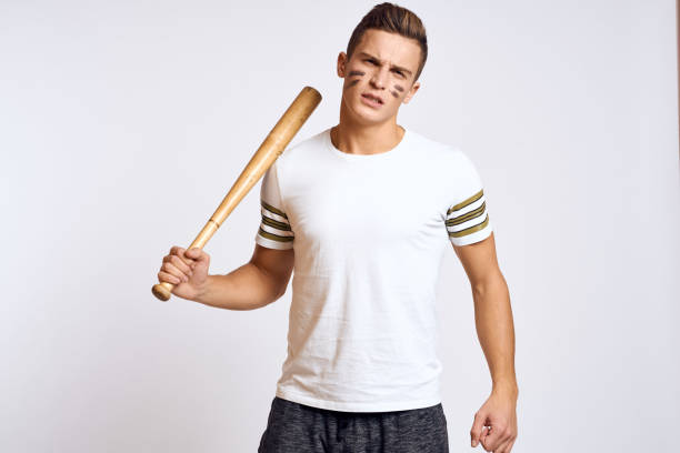 istock a man with a baseball bat on a light background exercises kicks sport ball model 2056284616