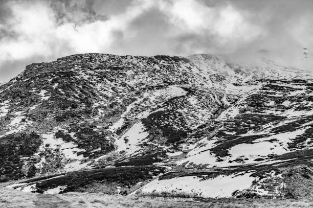 istock Corno alle Scale covered in snow and clouds in winter 2056290318