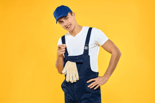 istock Man in working uniform emotions rendering service delivery service yellow background 2056315352