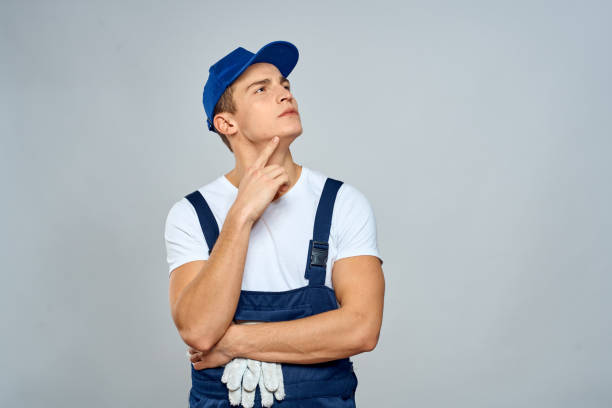 istock working man in uniform service lifestyle delivery service light background 2056320642