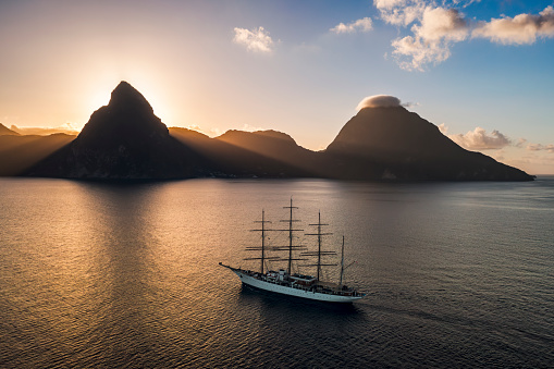 A view of a large sailing ship approaching Soufriere with the Petit and Gros Pitons in the background, Saint Lucia on 22nd February 2024.