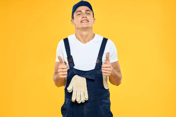 istock Man in working uniform emotions rendering service delivery service yellow background 2056328672