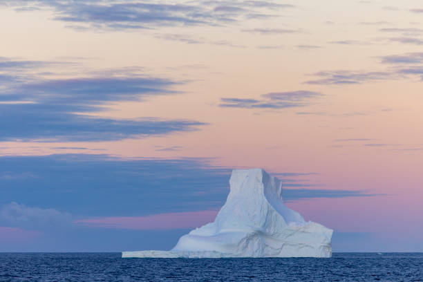 istock A tabular iceberg and beautiful sunset sky, Antarctica. 2056331863