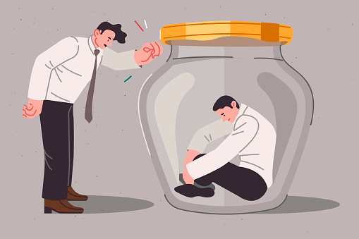 Boss is trying help and support upset man sitting in jar due to alienation from colleagues and lack of corporate culture. Manager provides psychological assistance or support to company employees
