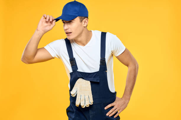 istock Man in working uniform emotions rendering service delivery service yellow background 2056335178