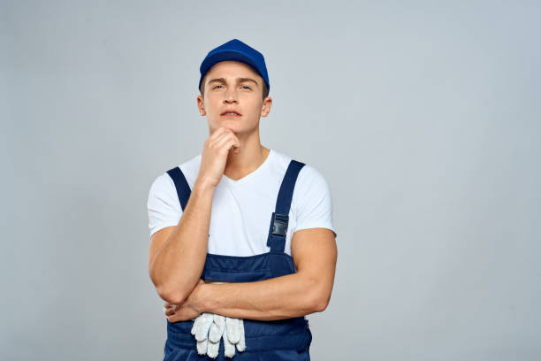 istock working man in uniform service lifestyle delivery service light background 2056335735