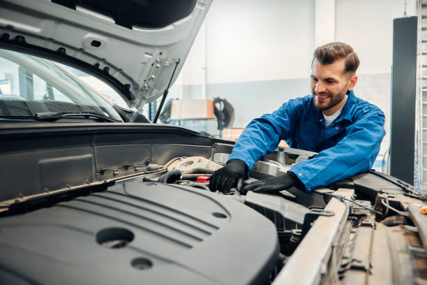 istock Auto mechanic working in garage. Repair service. 2056336817