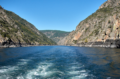 Sailing along the Sil River between its canyons and observing the terraces of the heroic harvest in Sober, Lugo, Spain