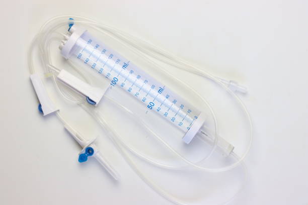 istock Measured volume infusion set for fluids isolated in a white background 2056370889