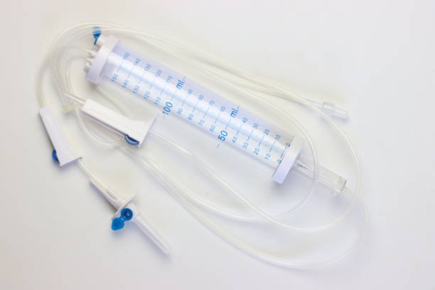 istock Measured volume infusion set for fluids isolated in a white background 2056370899