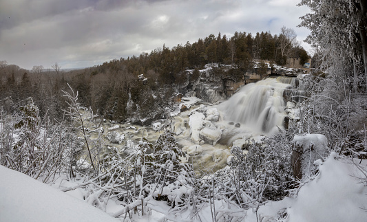 A panoramic view of Inglis Falls near Owen Sound, Ontario as it crashes its way down the rocks and through the surrounding forest.