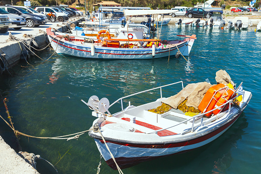 Zakynthos, Greece - August 17, 2016: Fishing boat is moored in port of Agios Sostis village