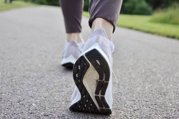istock A woman running outdoors 2056406819