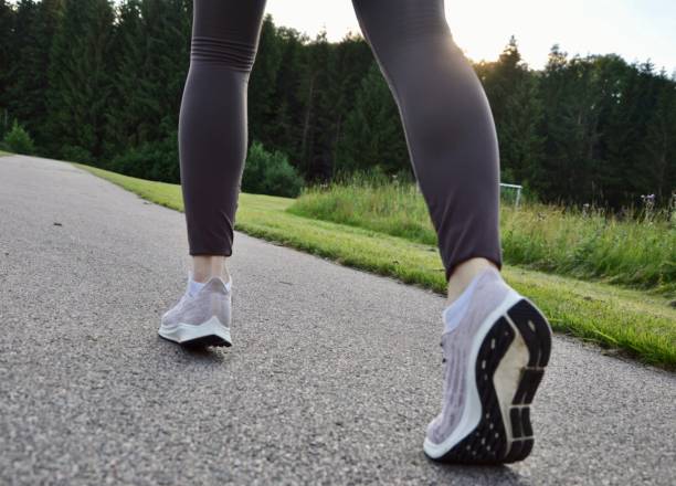 istock A woman running outdoors 2056406823