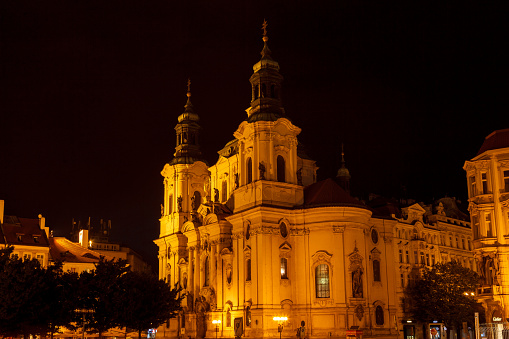 St Nicholas twin towers facade at night in Prague Czech Republic
