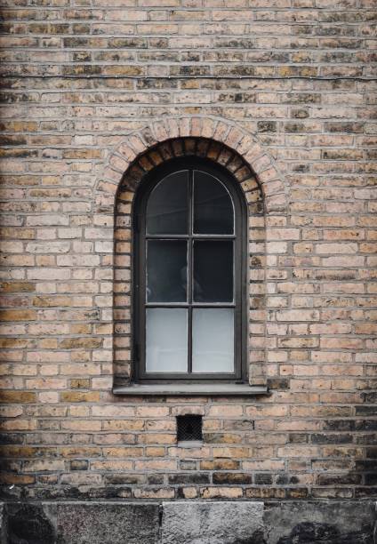 Victorian red brick warehouse barred windows at the historic docks at Gloucester.