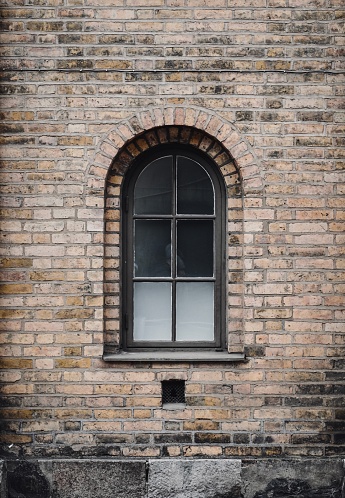 Photo of an old stone brick wall and a window