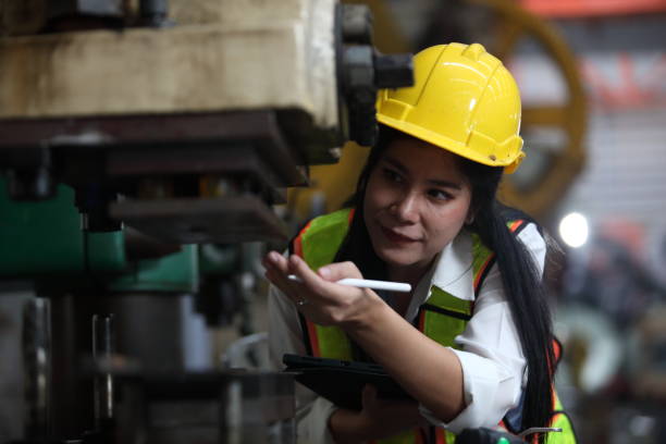 istock engineer team or worker team  with safety uniform standing at industry. 2056455792