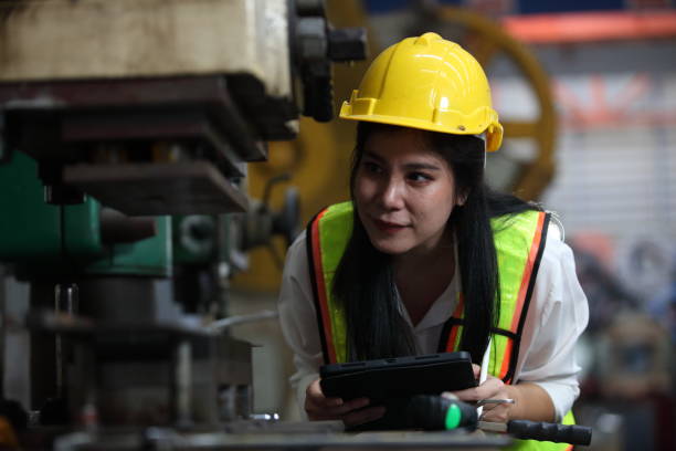 istock engineer team or worker team  with safety uniform standing at industry. 2056458984