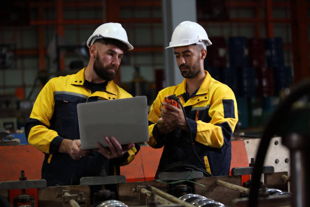 istock worker or engineer working in factory with safety uniform , safety hat and safety glasses , image is safety concept or happy workplace 2056464362