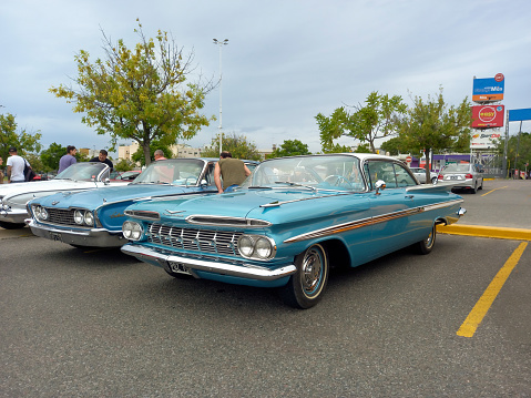 Lebanon,TN - May 14, 2022: Low perspective rear corner view of a  1955 Ford Fairlane Crown Victoria Skyliner Hardtop Sedan at a local car show.