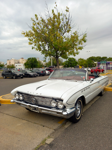 Buenos Aires, Argentina - Feb 25, 2024: old white 1961 Buick Electra convertible at a classic car show in a parking lot. Copy space