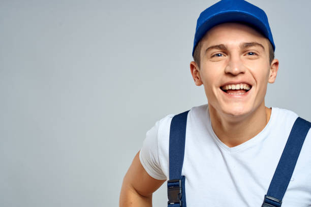 istock working man in uniform service lifestyle delivery service light background 2056485111