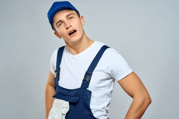istock working man in uniform service lifestyle delivery service light background 2056493472
