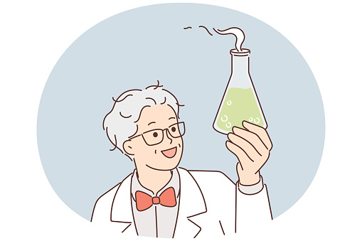 Laboratory assistant in white coat holds flask with green fuming liquid while examining chemical reaction of reagent. Gray-haired chemist or scientist discovering new drug to fight terrible disease