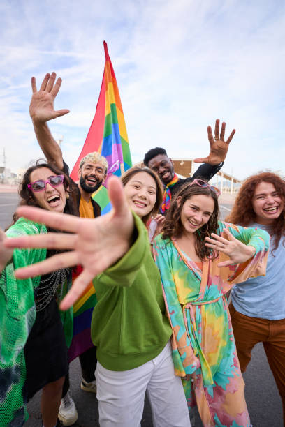 istock Group of people are taking a selfie with a rainbow flag 2056617697