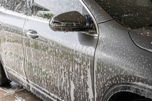 istock car cleaning and washing with foam soap 2056736835