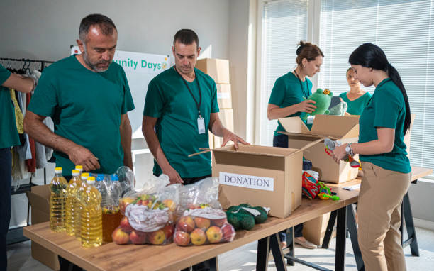 istock Volunteers working in community donation center. 2056738446