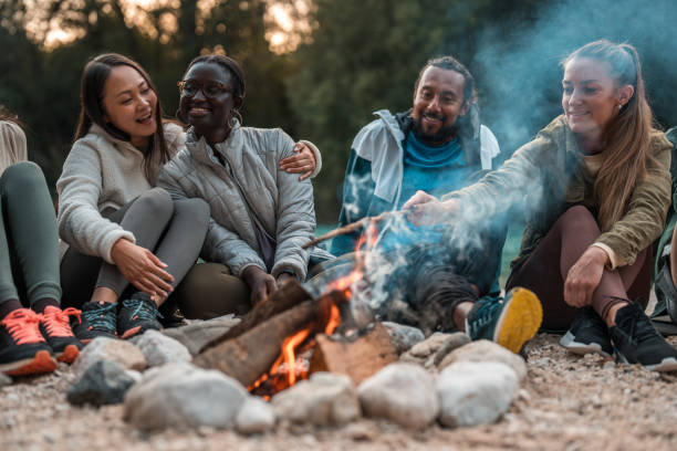 istock Mixed Race Friends Sharing Stories by the Campfire 2056741640