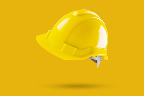 istock Safety construction helmet on yellow background 2056749244