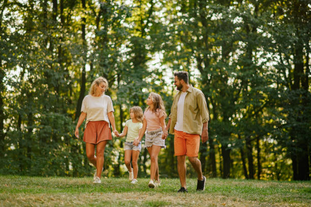 istock A loving family spending time together in forest and taking a walk. 2056751074