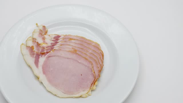 Canadian Bacon on White plate rotated.
