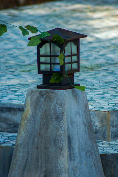 istock wooden lantern in the garden 2056819752