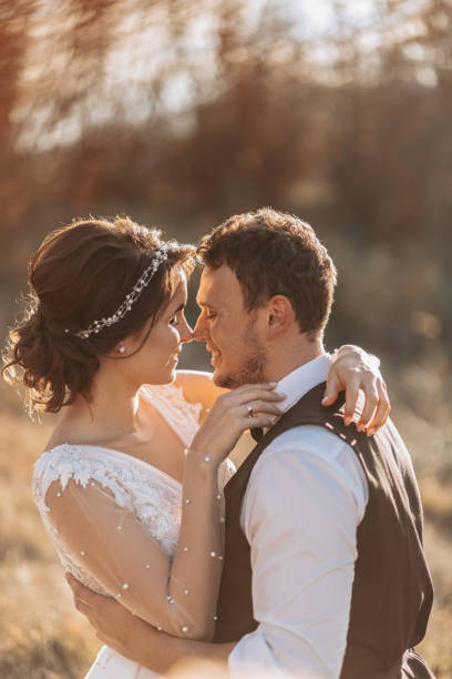 istock Beautiful wedding couple laughing and kissing 2056890134