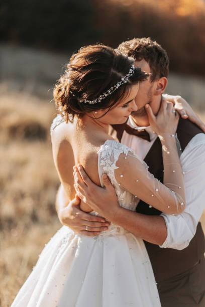 istock Beautiful wedding couple laughing and kissing 2056890141
