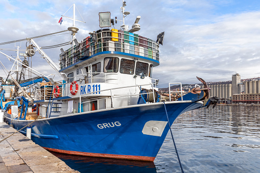 Rijeka, Croatia - March 2, 2024: Fishing boat tied up in the port of Rijeka